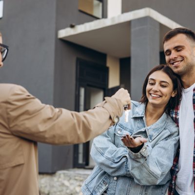 Young family with realtor looking for a new house